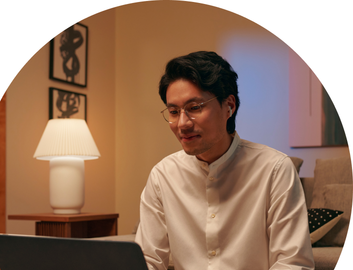 Japanese man looking at laptop at home
