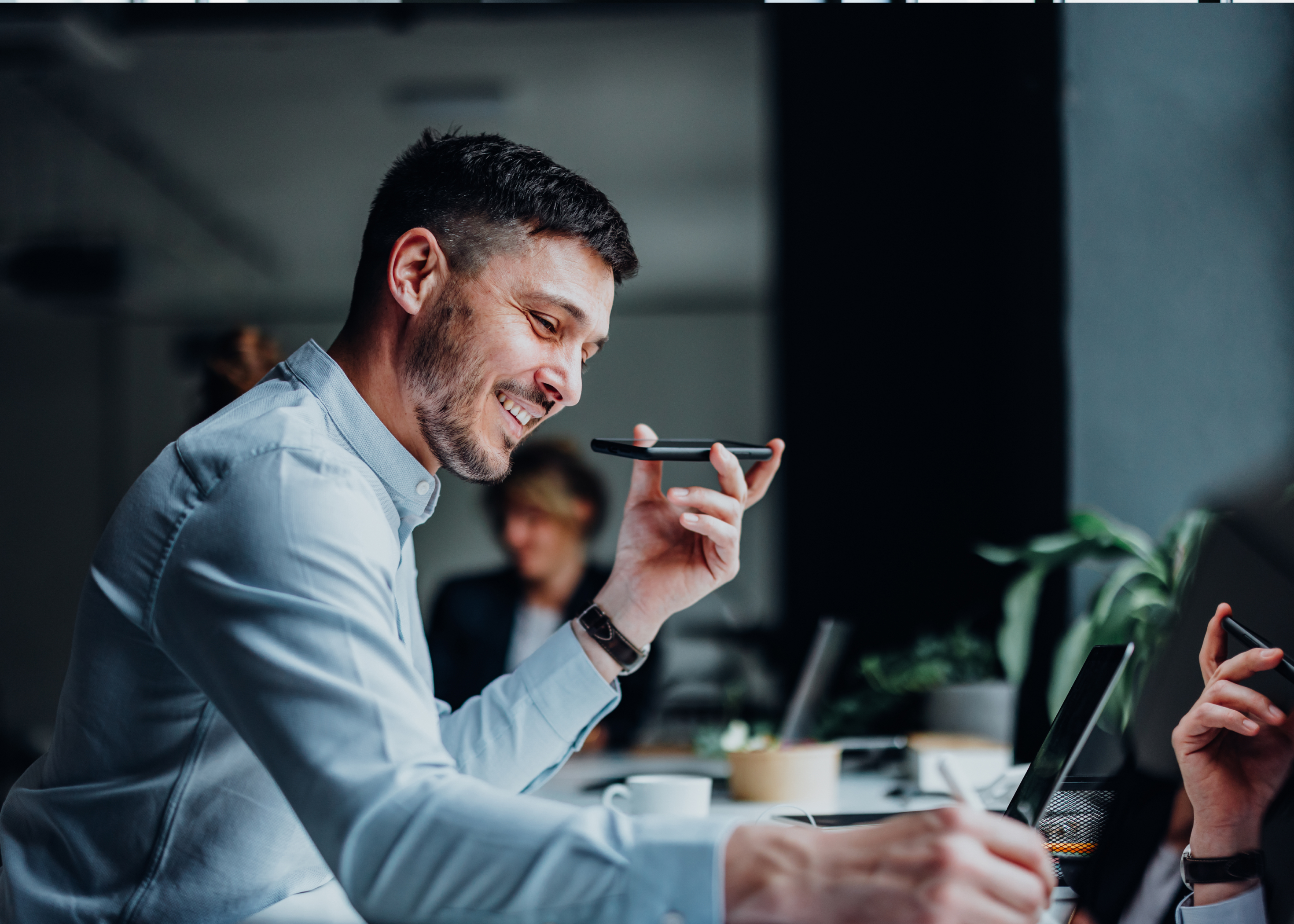 Business man smiling and talking on the phone