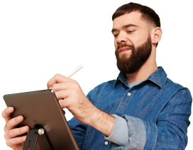Man in blue shirt writing on a digital tablet