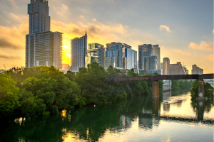 City skyline and river at sunset in the summer. 