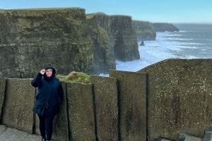 Martha, an employee of Velocity Global, standing in the coast of Ireland