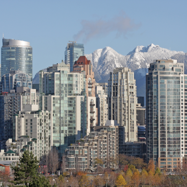 city with mountain range in background