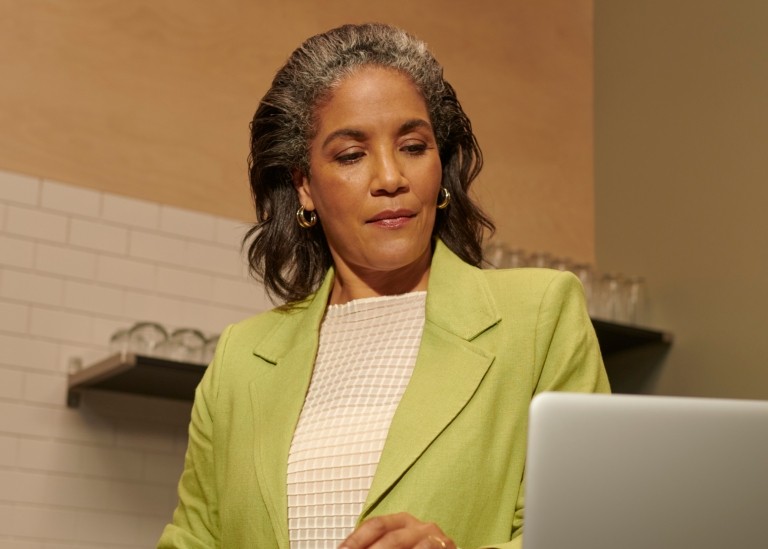 Woman looking at laptop
