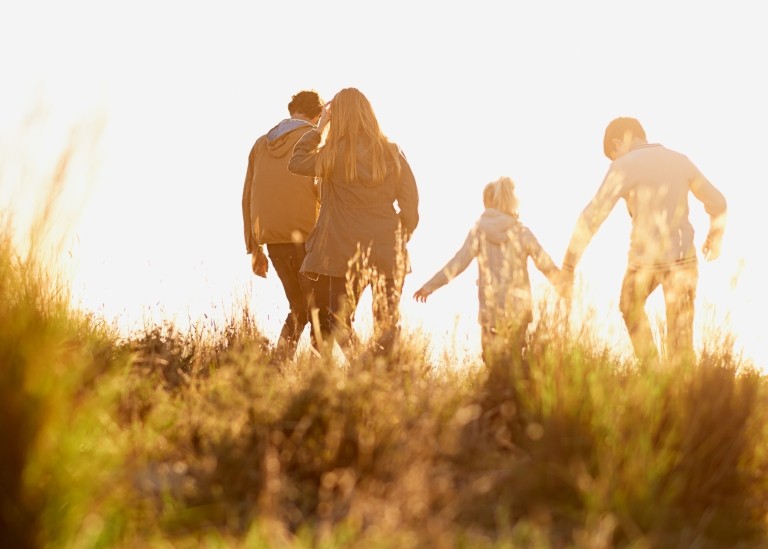 family walking in field