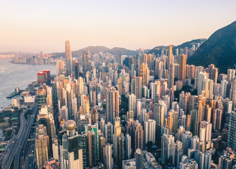 Hong Kong skyline surrounded by mountains and the ocean