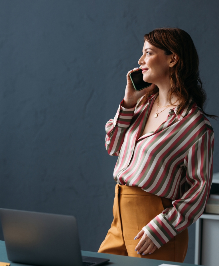 Global HR manager discussing global equity compensation on the phone