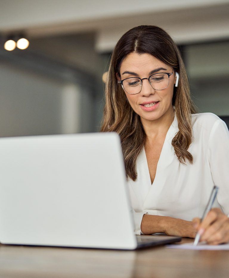 Woman looking at laptop
