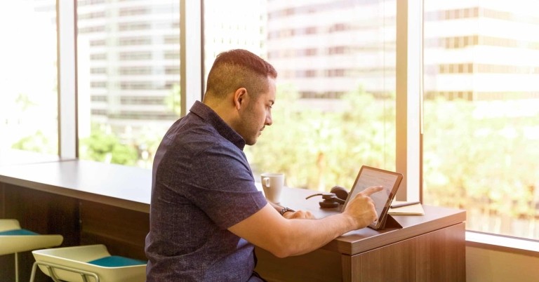 Man looking at tablet