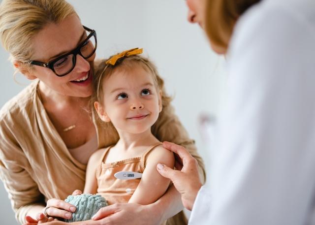 Mother and daughter engaging with a doctor