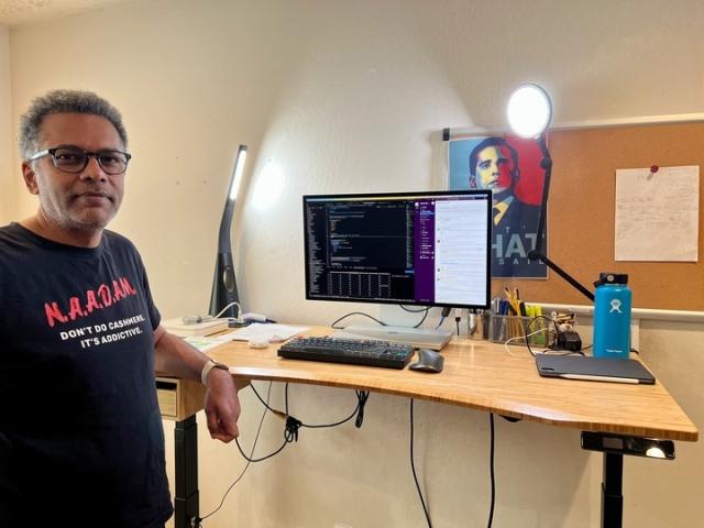 Velocity Global’s Vice President of Engineering & Chief Architect, Kumar Ramanathan shows off his home office set up 