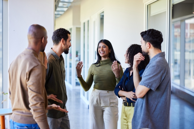 Coworkers discussing how an EOR can help their business expand globally