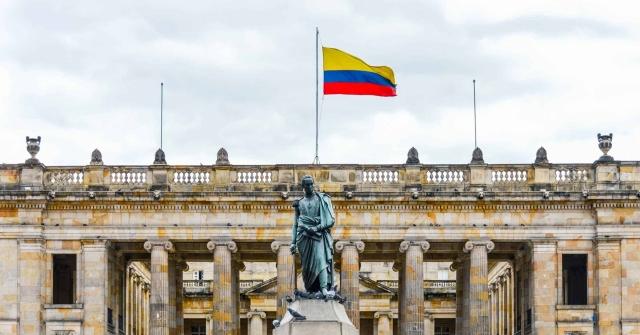 Colombian flag over monument