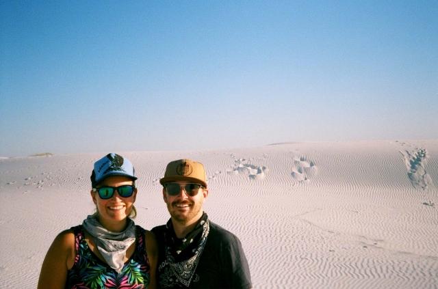A couple smiling in the desert